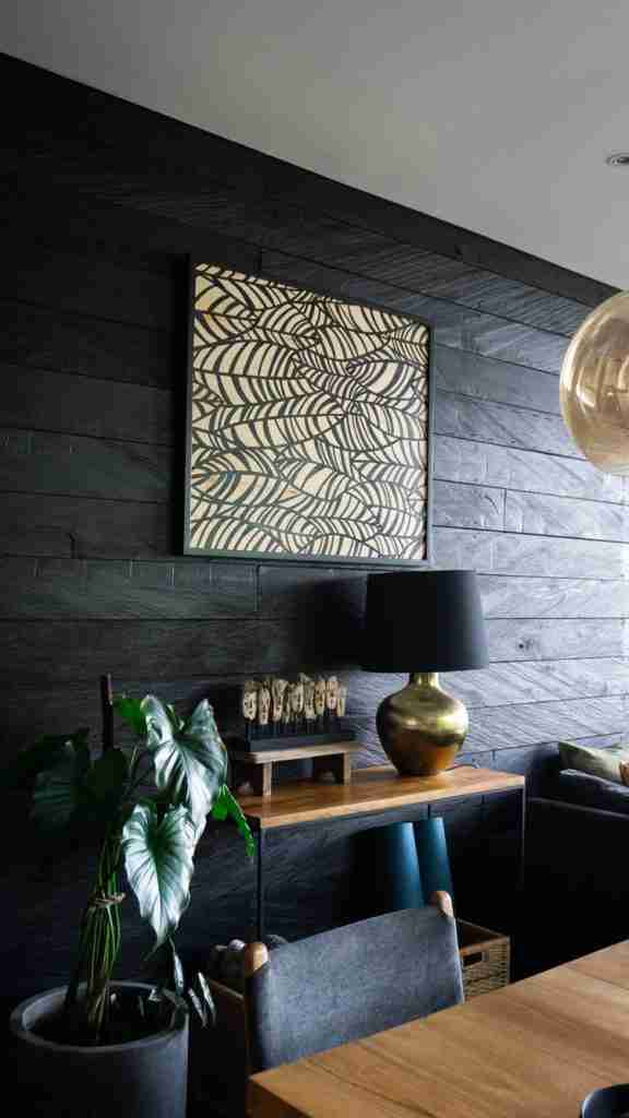 Framed artwork hanging in a stylish room at Munduk Cabins, Bali — curated jungle interiors captured by Bohemian Bela.