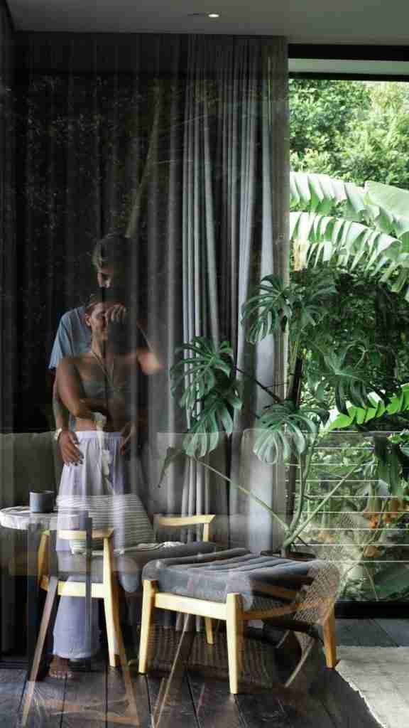 Moody window reflection at Munduk Cabins, Bali capturing jungle shadows and soft light — aesthetic design detail featured on Bohemian Bela.