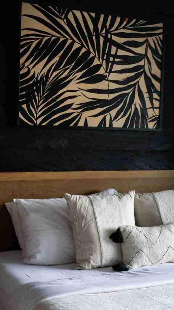 Warm, minimalist bedroom at Munduk Cabins with wooden accents and cozy textures — peaceful Bali lodging featured on Bohemian Bela.